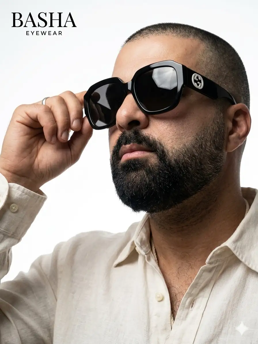 Sunglasses: Thick-rimmed, oversized square-frame black acetate sunglasses with a high-gloss finish